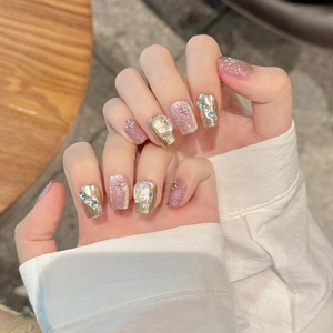 Luxury handmade press-on nails with cat-eye glitter, gold texture, and crystals