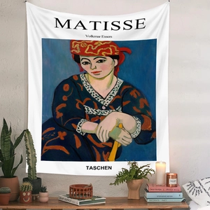 Artistic Henri Matisse tapestry detail on textured wall with green plants decoration