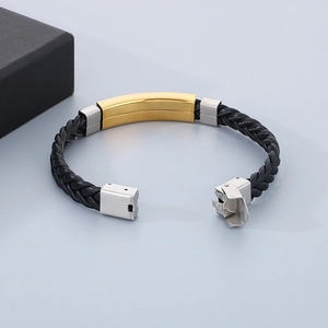 Detail of black woven leather bracelet with polished stainless steel clasp and gift box