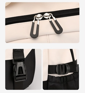 Detail of durable nylon backpack showing smooth silver zippers and black side buckles