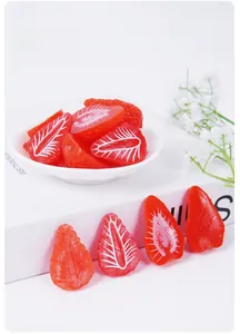 Detailed macro view of realistic artificial strawberry slices for miniature DIY crafts