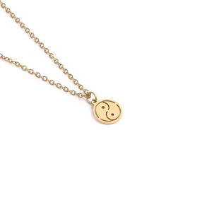 Minimalist gold-plated stainless steel necklace featuring a Tai Chi Yin Yang cutout pendant