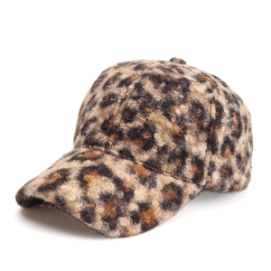 Detailed side view of leopard print faux fur baseball cap with plush textured finish