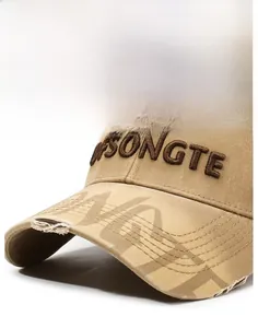 Close-up of khaki baseball cap featuring 3D brown embroidery and vintage distressed brim