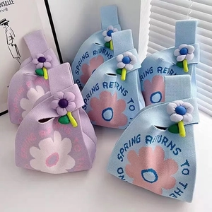Floral knitted wedding gift handbags in light blue and purple with 3D flower charms