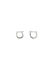 Minimalist silver U-shaped hoop earrings for women with polished metal finish on white background