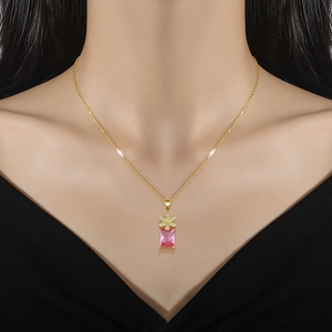 Elegant gold titanium necklace with pink square gemstone and floral zircon pendant detail