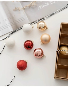 Mix of matte and glossy Christmas ornaments in gold and red for tree decoration