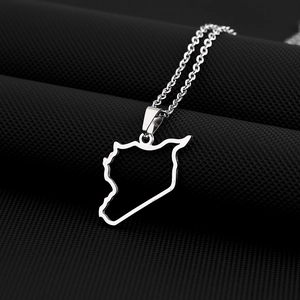 Macro shot of silver titanium steel Syrian map pendant with O-link chain on textured surface