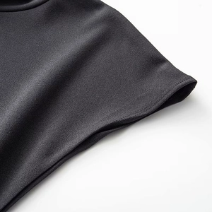 Detailed close-up showing precision stitching and black crepe fabric texture of the dress