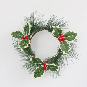 Christmas candle ring with PVC pine needles, holly leaves and red berries on rattan base