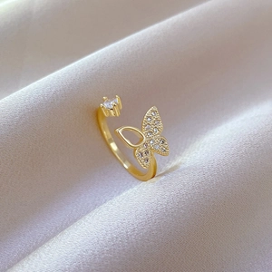 Adjustable gold butterfly open ring with sparkling white cubic zirconia on satin cloth