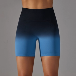 Detailed close-up of seamless gradient high waist fitness shorts in black and blue colors