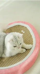 Detail of strawberry sisal cat scratching mat with pink striped velvet edge decoration