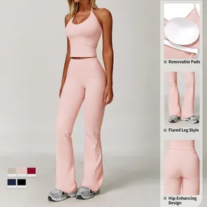 Pink halter yoga set with cross-waist flared pants and removable chest pads
