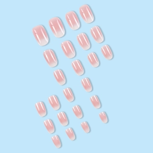 Short oval press-on nails with pink gradient finish and glossy texture on blue background