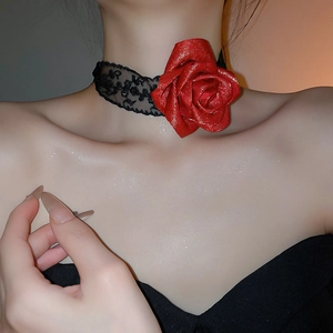 Detailed view of elegant black lace choker featuring a shimmering red rose pendant
