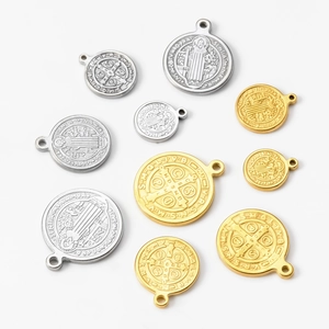 Religious St. Benedict round pendants in gold and silver steel with detailed 3D relief