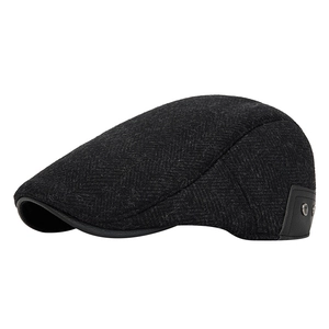 Deep grey herringbone wool newsboy cap for men with vintage leather rivet detail