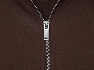 Close-up of durable silver metal zipper on dark brown fleece hoodie set jacket