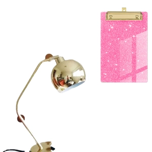 Pink glitter acrylic clipboard with gold metal clip and sparkling sequin texture finish