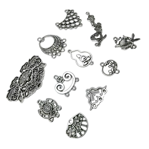 Assorted silver alloy vintage charms including butterfly and flower for DIY jewelry making