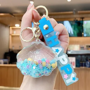Shell floating bottle keychain with blue sequins and Happy letter strap for bag decor