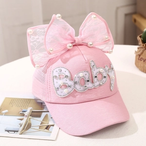 Detail of pink girls baseball cap with lace bow, pearls and crystal Baby patch