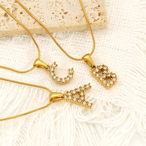 Gold plated stainless steel alphabet A B C letter pendant necklace with pavé crystal accents