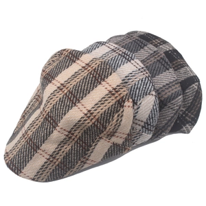 Set of three men's winter tweed flat caps with classic British vintage plaid patterns