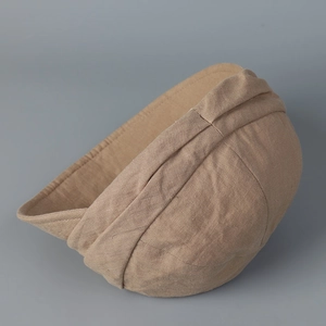 Detailed view of khaki linen miki hat featuring a vintage pleated texture and folded brim