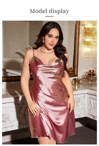 Detail of pink floral satin nightgown showing premium silky fabric and print texture