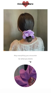 Detail view of large lavender chiffon scrunchie showing fabric texture and hair styling