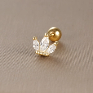 Macro shot of crown stud earring with marquise cubic zirconia and gold screw ball back
