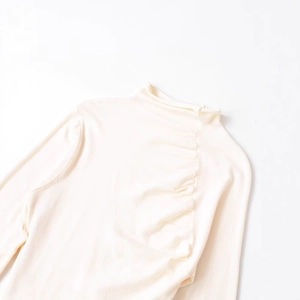 Minimalist off-white wool turtleneck knit sweater with detailed pleated collar texture