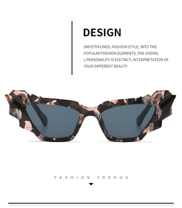 Detail of trendy cat-eye sunglasses with unique 3D geometric marble texture frames