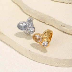 Detailed view of two-tone molten lava texture rings with high-clarity zircon stones