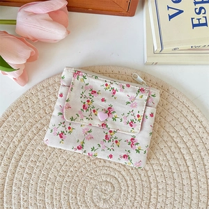 Close-up of floral canvas coin purse with pink heart button and double compartment