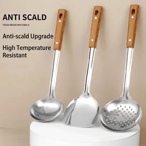 Polished stainless steel cooking utensil set with heat-resistant wooden handles