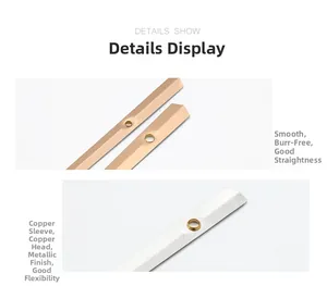 Macro detail of smooth metallic clock hands with precision copper sleeves and golden finish