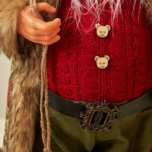 Plush Santa Claus ornament with knitted textures and faux fur details for Christmas decor