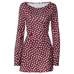 Detail view of burgundy wine mini dress featuring white polka dot patterns and long sleeves