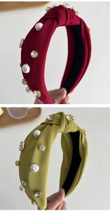 Detail of ribbed knotted headbands with scattered pearls and rhinestones in red and green