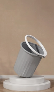 Detail view of large gray Roman striped garbage bin with contrasting white press ring