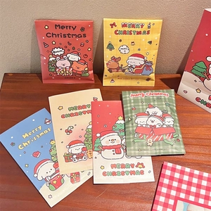 Detailed view of colorful Christmas cartoon gift bags with dog and snowman patterns
