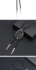Detail of vintage bolo tie with oval gemstone pendant and braided leather rope