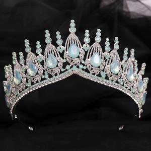 Detail of silver bridal tiara with sparkling rhinestones and light blue opals
