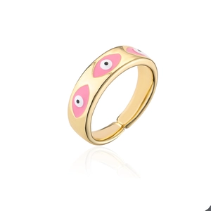 Close-up of gold-plated evil eye ring with pink enamel detail and adjustable open band