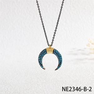 Detailed view of bohemian horn pendant necklace with micro-pave blue turquoise beads