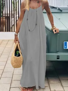 Gray backless maxi dress with spaghetti straps and pleated details for beach vacation